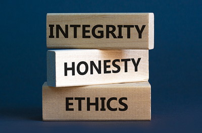 integrity honesty ethics written on stacked wooden blocks