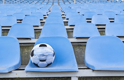 empty seats football with face mask