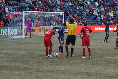 player setting up direct free kick