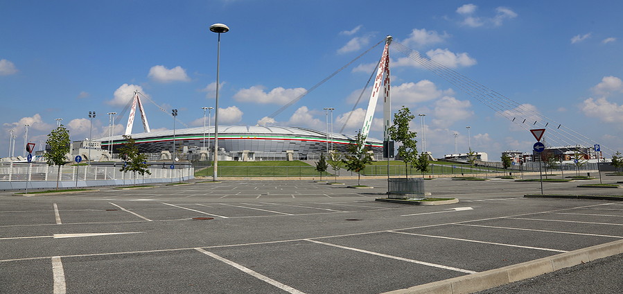 car parking bays with football stadium in background